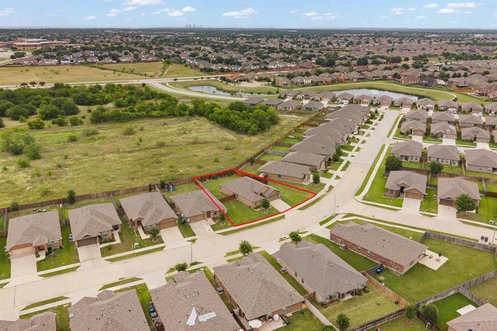 4600 Fringetree Way Crowley, TX 76036 - Photo 35 of 40 Aerial perspective of a suburban neighborhood featuring single-story homes with brick exteriors and attached garages