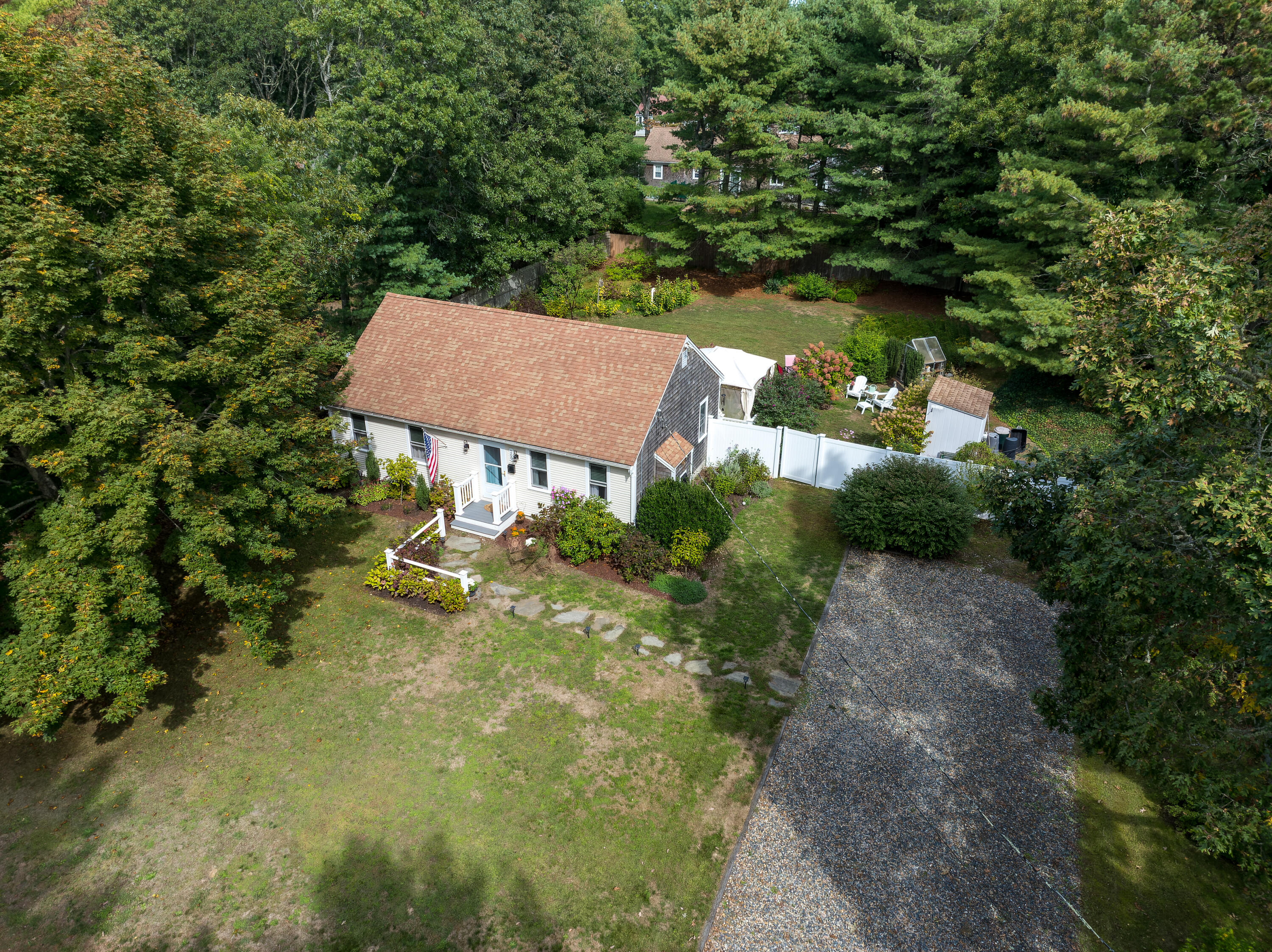 an aerial view of a house with yard swimming pool and outdoor seating