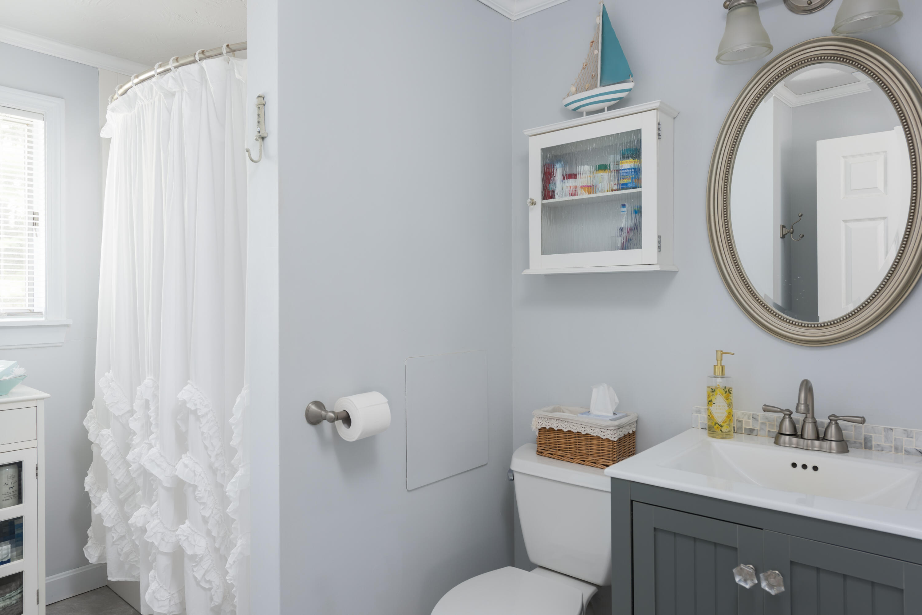 268 Bumps River Road Osterville, MA 02655 - Photo 11 of 33 a bathroom with a sink mirror and toilet