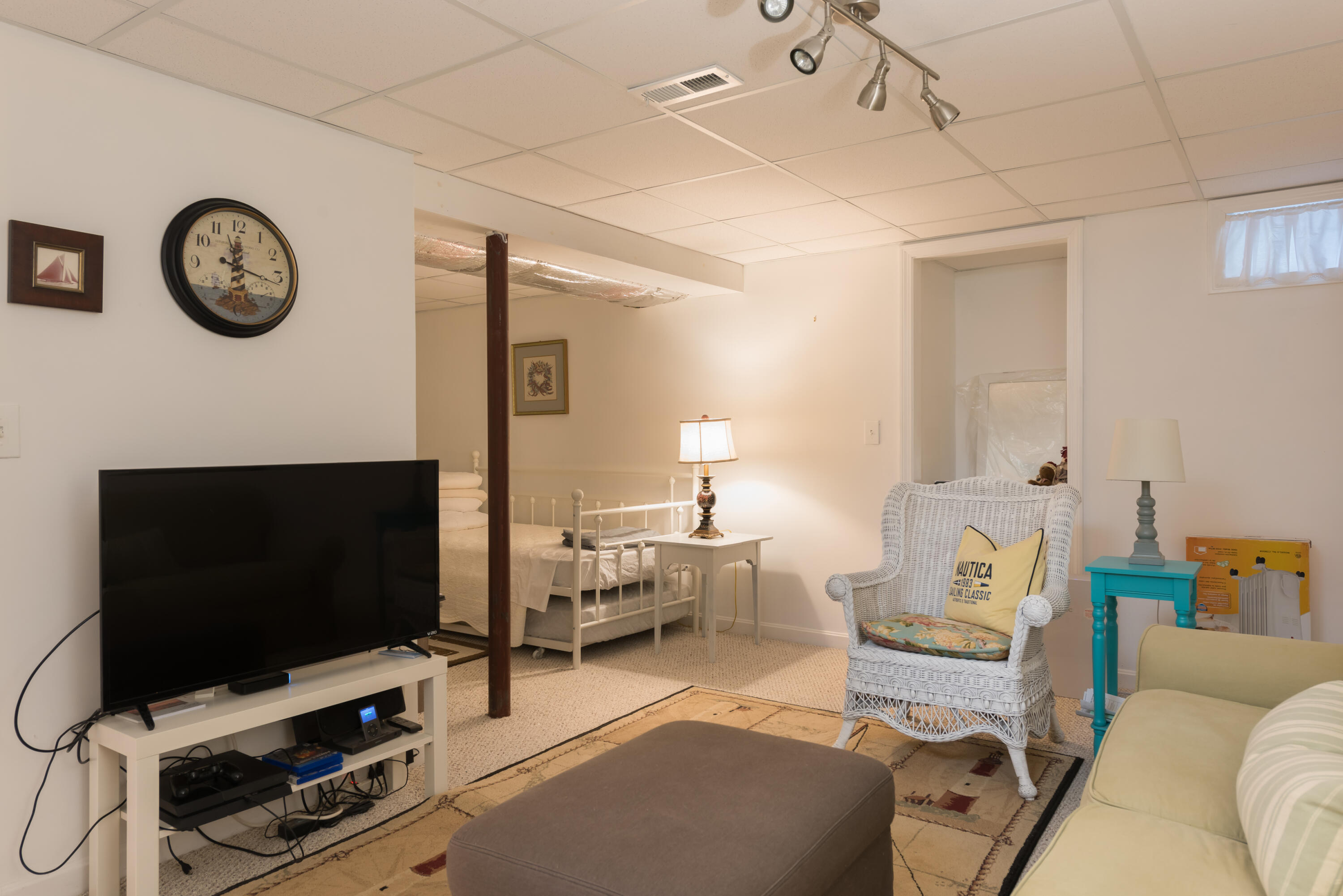 268 Bumps River Road Osterville, MA 02655 - Photo 13 of 33 a living room with furniture and a flat screen tv