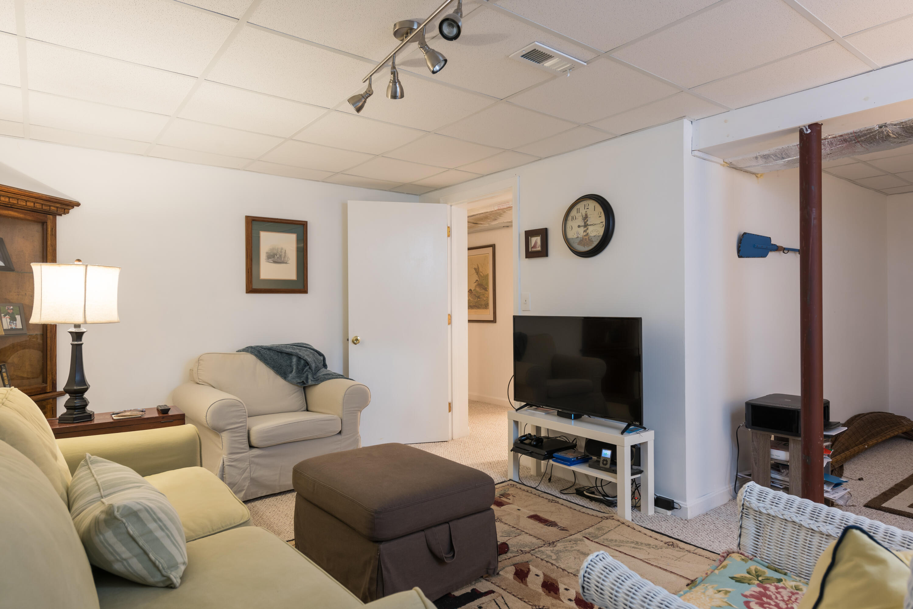 268 Bumps River Road Osterville, MA 02655 - Photo 14 of 33 a living room with furniture and a flat screen tv