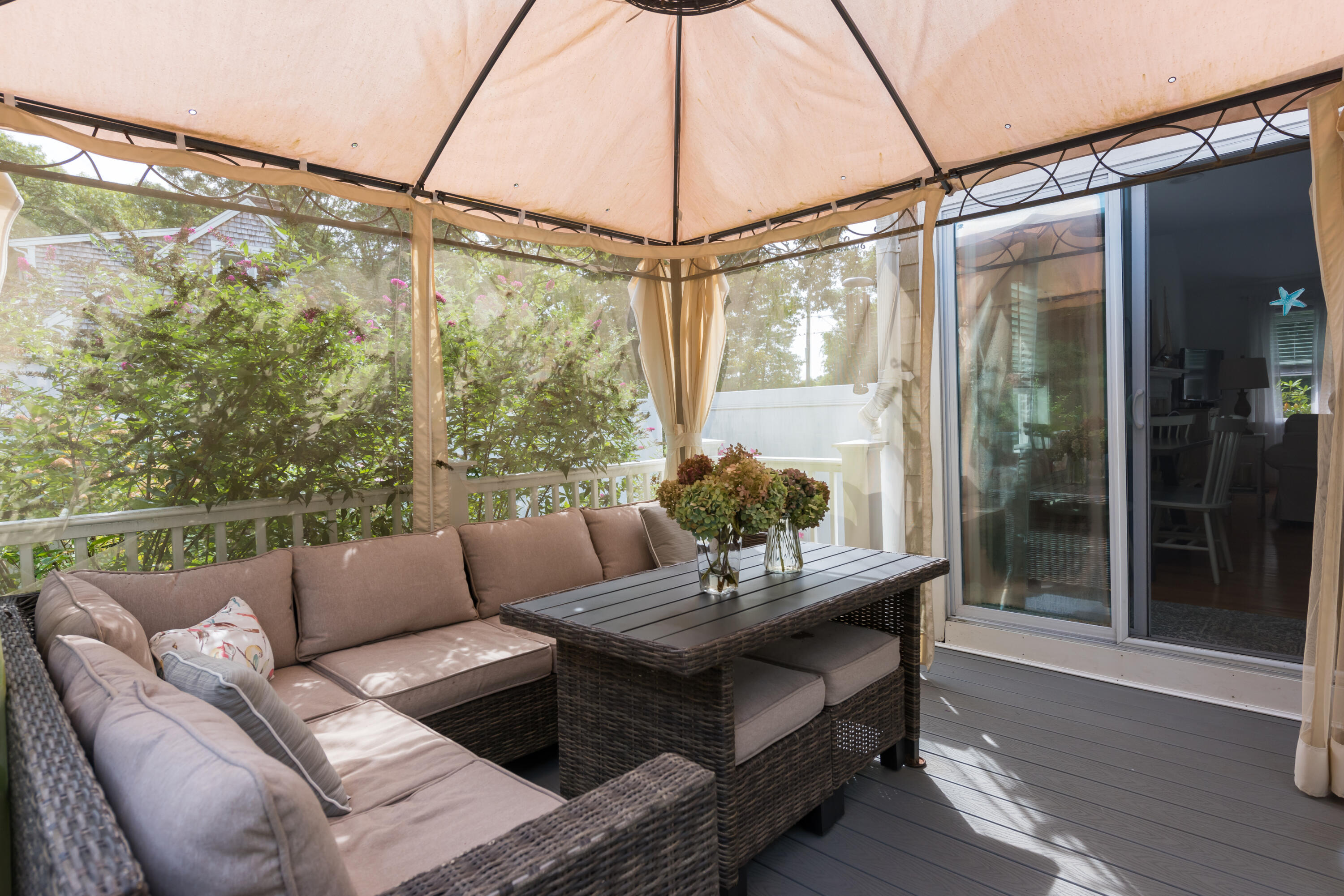 268 Bumps River Road Osterville, MA 02655 - Photo 18 of 33 a balcony with furniture and a potted plant