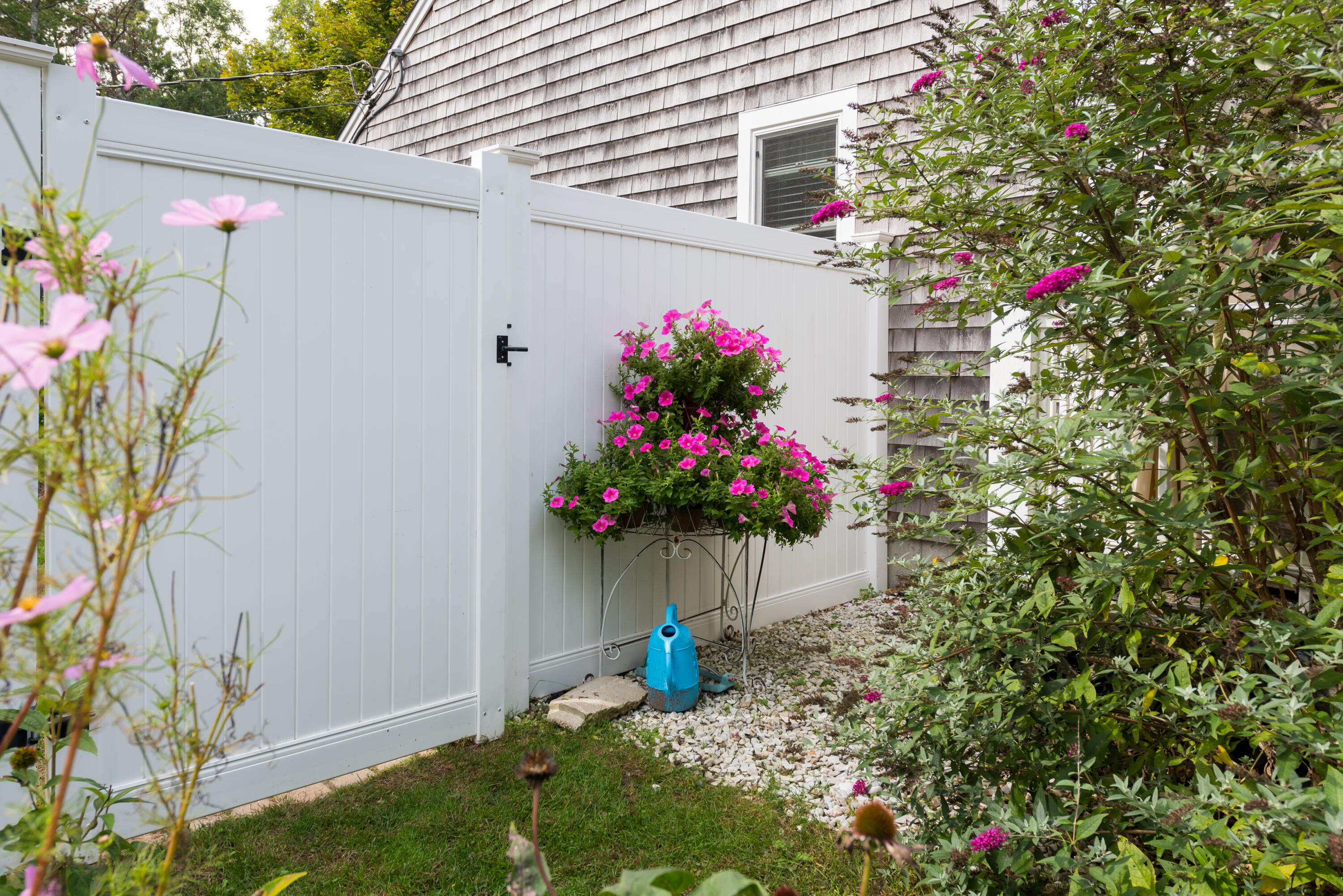 268 Bumps River Road Osterville, MA 02655 - Photo 19 of 33 a view of a outdoor space with a lot of flowers