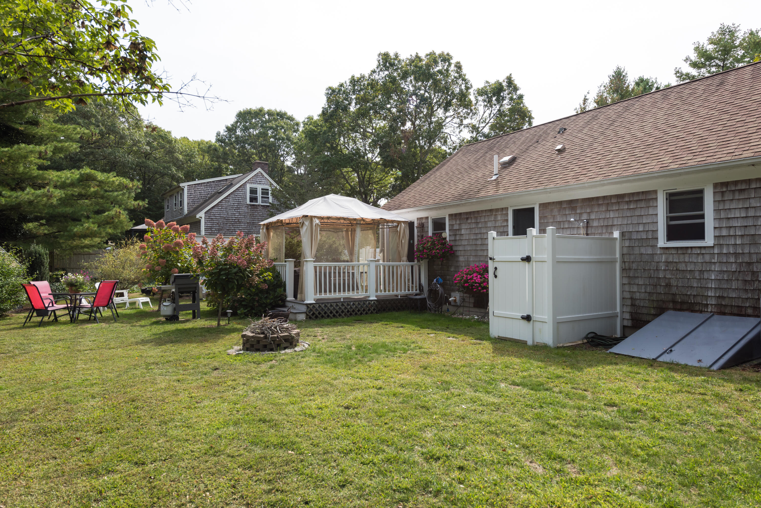 268 Bumps River Road Osterville, MA 02655 - Photo 22 of 33 a view of a house with backyard and sitting area