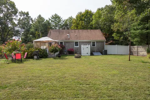 a view of a tree in front of a house
