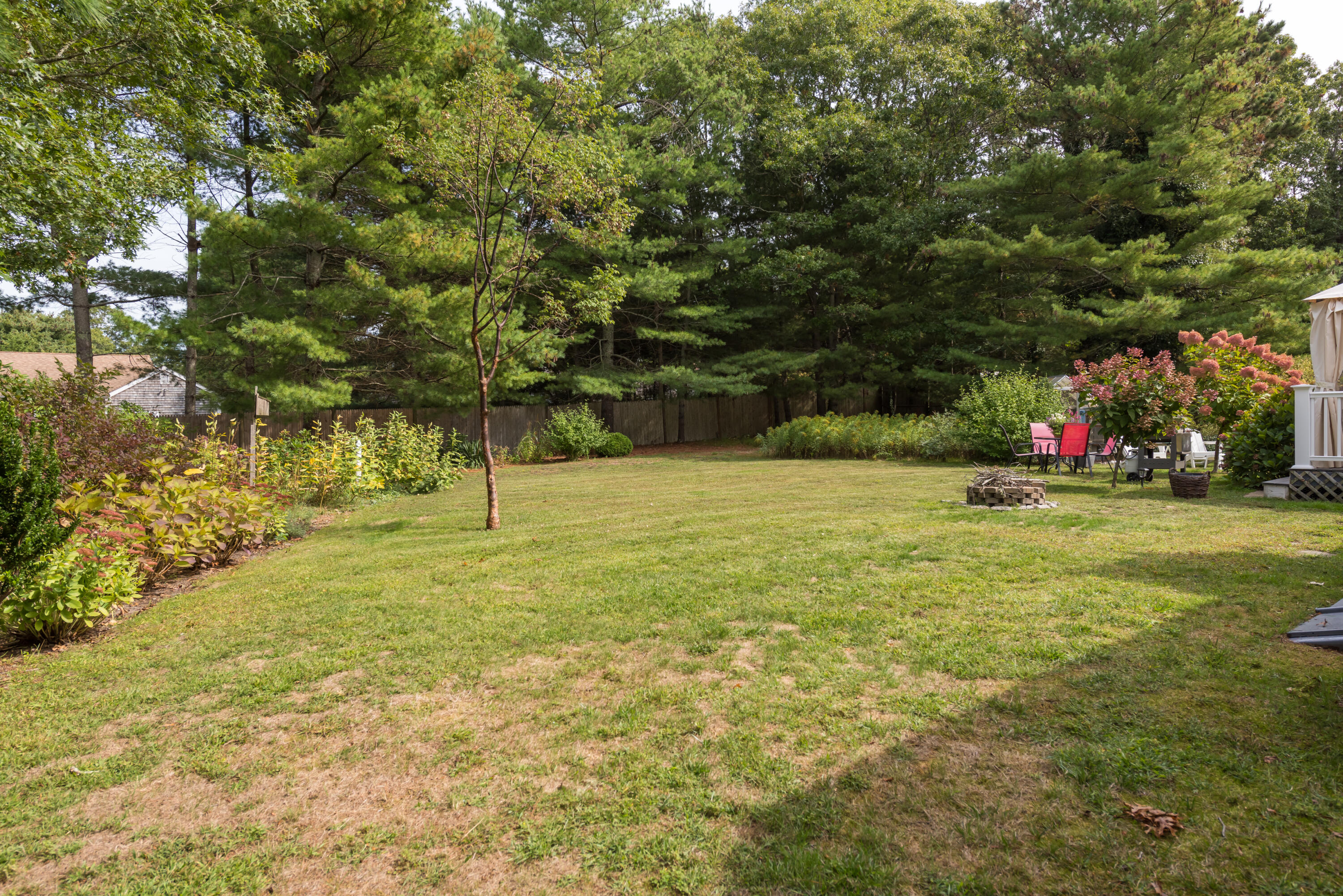268 Bumps River Road Osterville, MA 02655 - Photo 25 of 33 a view of a tree in front of a house