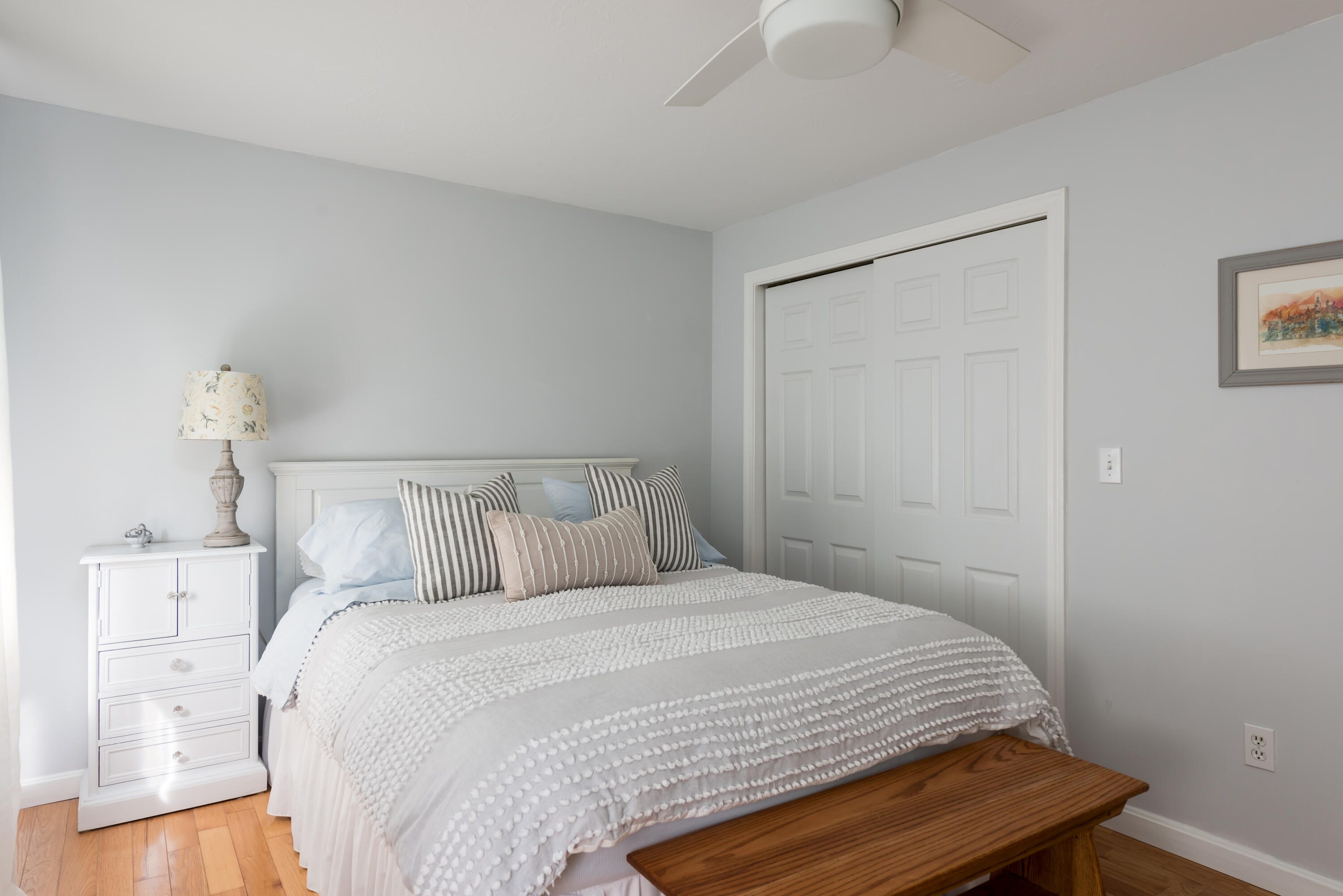 268 Bumps River Road Osterville, MA 02655 - Photo 10 of 33 a bedroom with a bed and a night stand