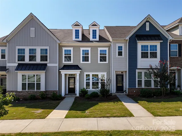 a front view of a house with yard