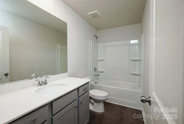 a bathroom with white walls