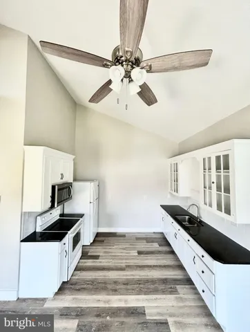 a spacious bathroom with a double vanity sink and a window