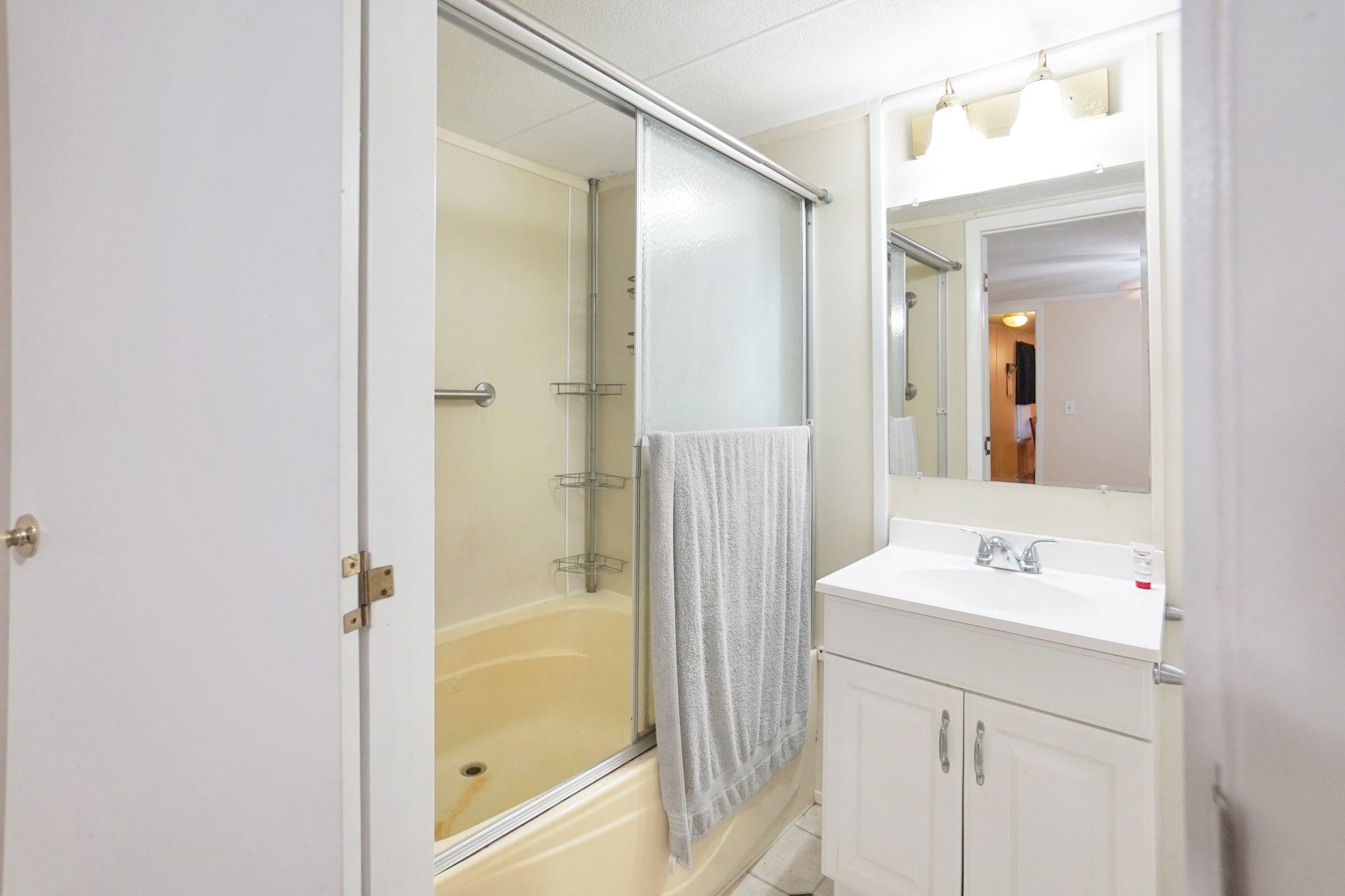 2840 South Main Street Tennessee Ridge, TN 37178 - Photo 26 of 44 a bathroom with a shower sink and mirror