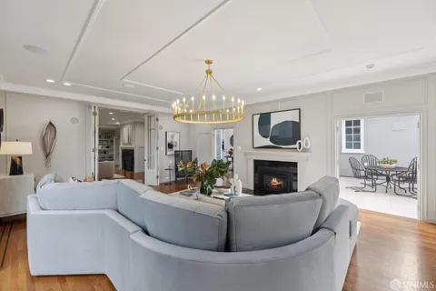 a view of an entryway with wooden floor and windows