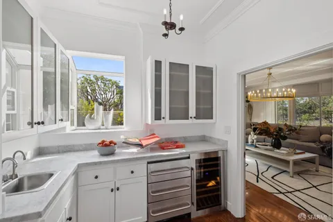 a view of a patio with couches table and chairs and potted plants