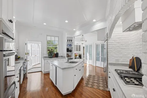 a view of a chairs and table in the balcony