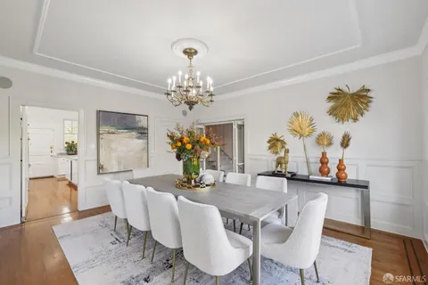 a bedroom with a bed couch and a window