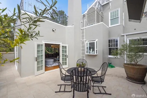 a bathroom with a sink mirror and shower