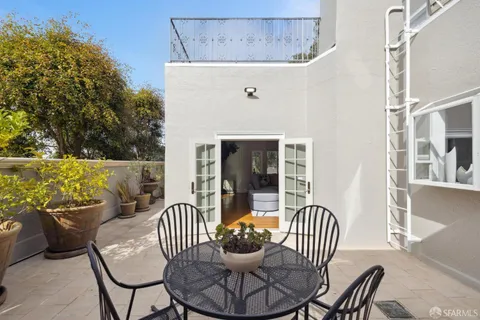 a bedroom with bed and a chandelier