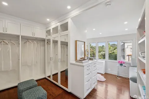 a kitchen with kitchen island granite countertop stainless steel appliances and sink