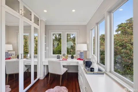 an empty room with windows and view