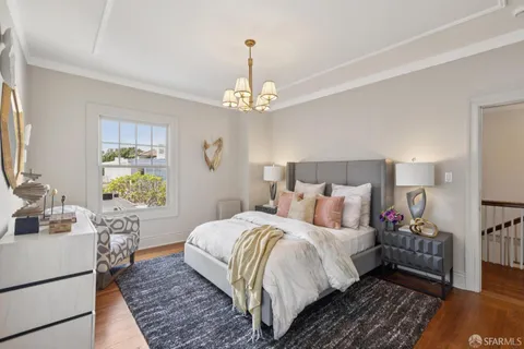 a view of a dining room with furniture and a large window