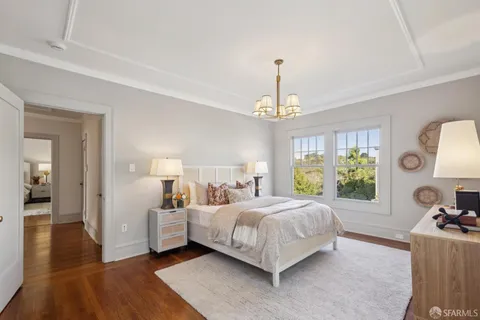 a kitchen with refrigerator and cabinets
