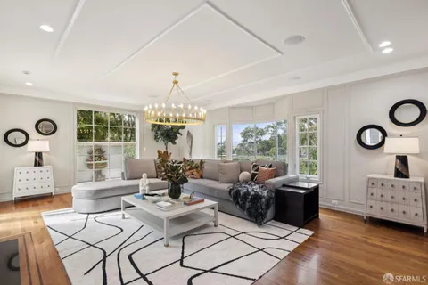 a view of a kitchen with a sink and wooden floor