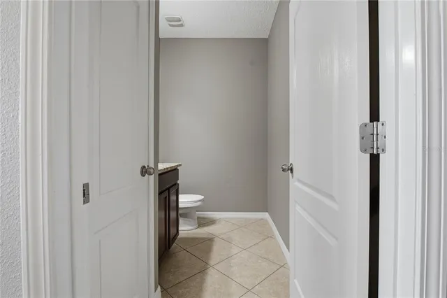 a view of a bathroom from a hallway