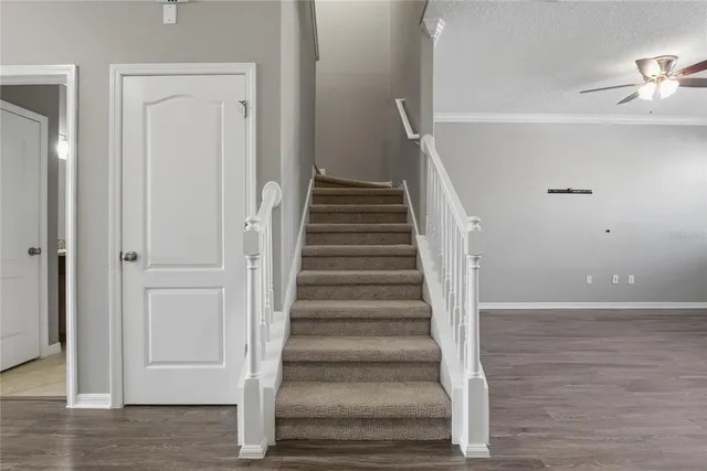 a view of an entryway with wooden floor