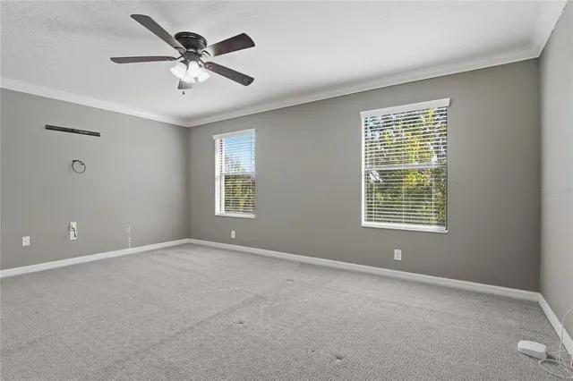 a bathroom with a granite countertop sink toilet a mirror and shower