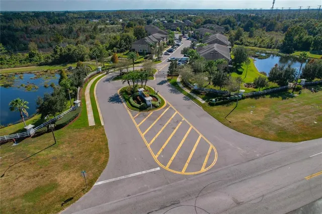 an aerial view of a house swimming pool and mountains