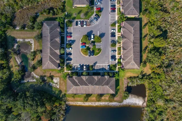 an aerial view of a house with a yard