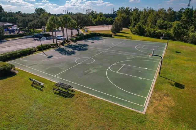 an aerial view of a house with garden space and lake view