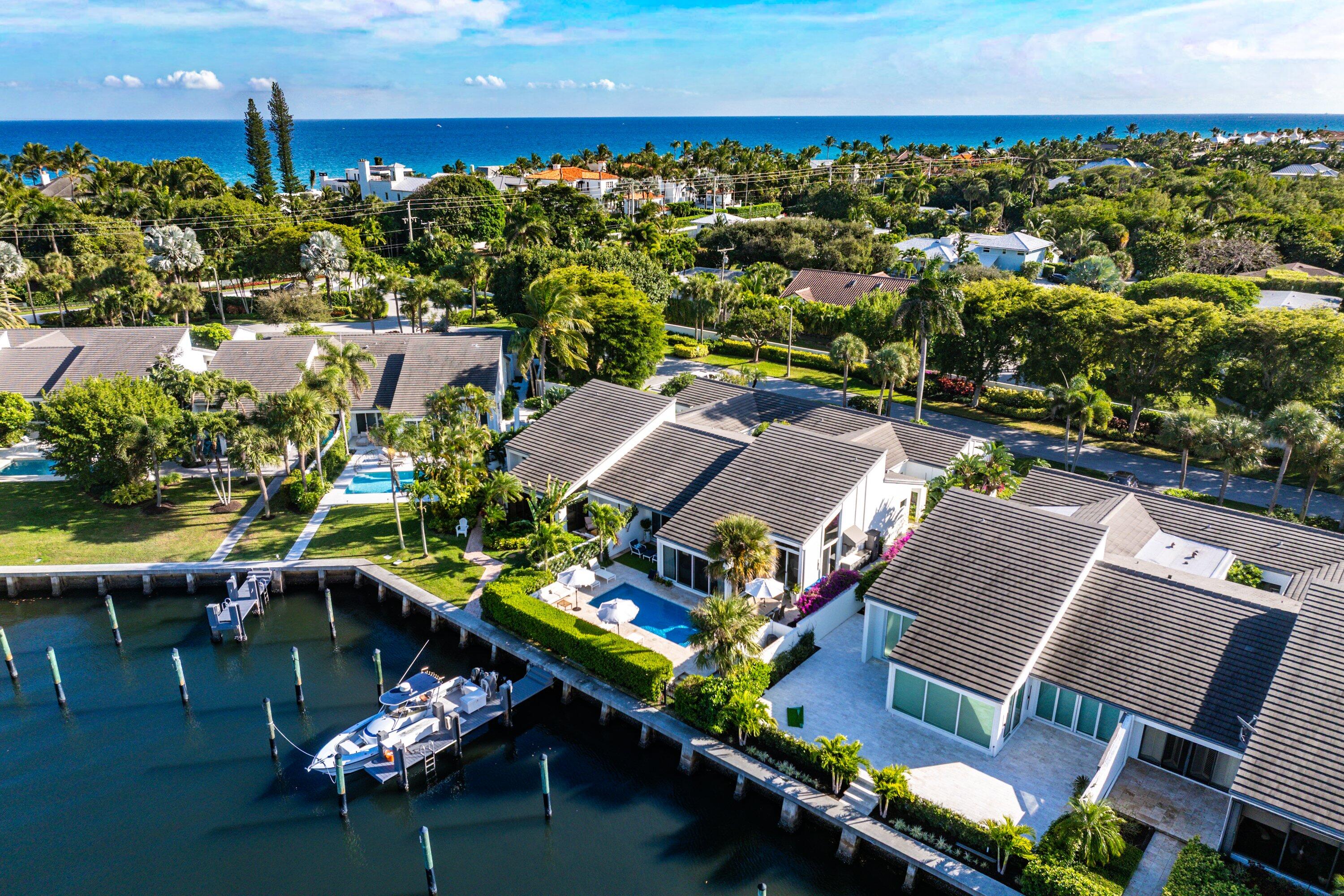 an aerial view of a house with a lake view