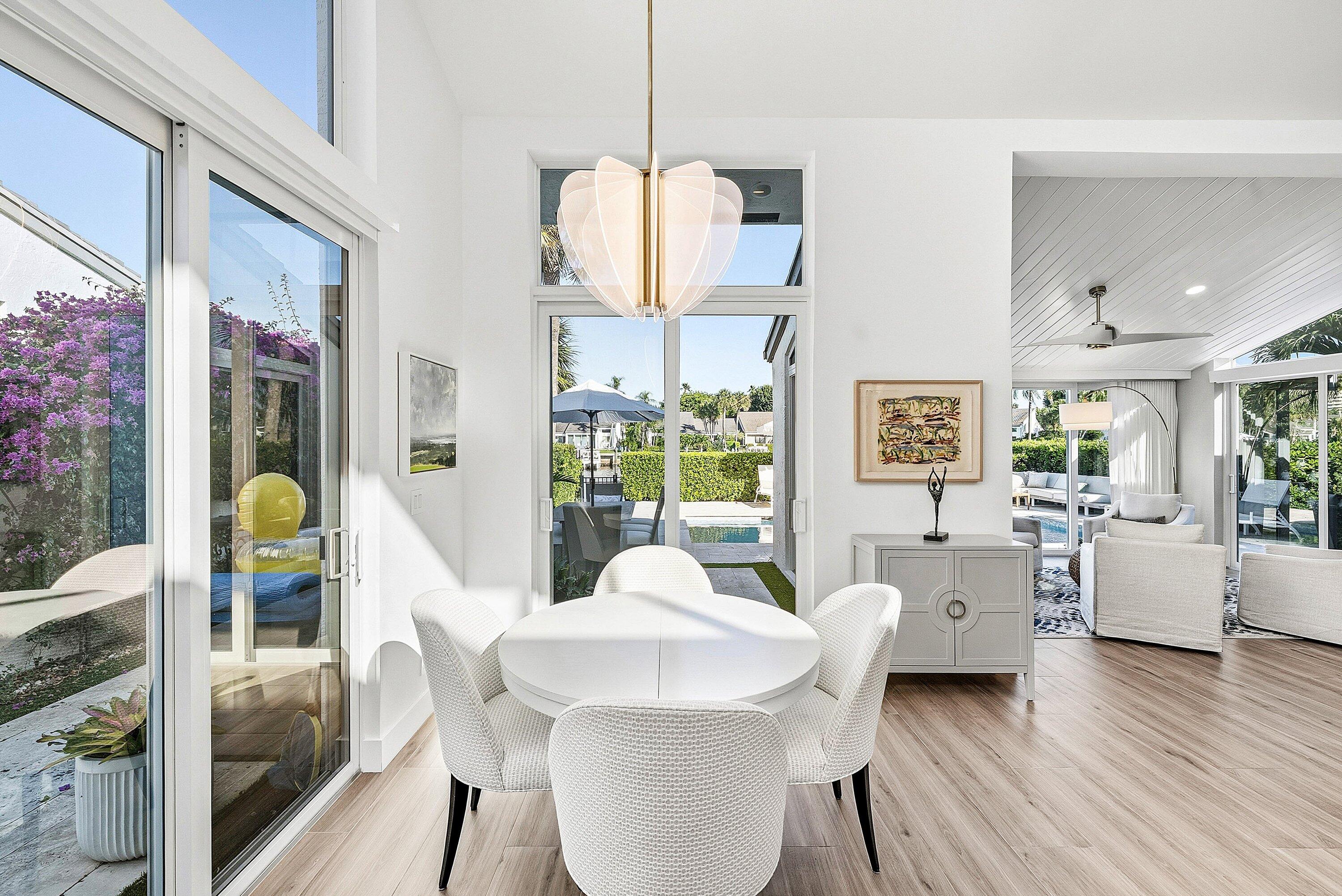 6110 North Ocean Boulevard, Unit 32 Ocean Ridge, FL 33435 - Photo 12 of 39 a dining room with wooden floor and furniture