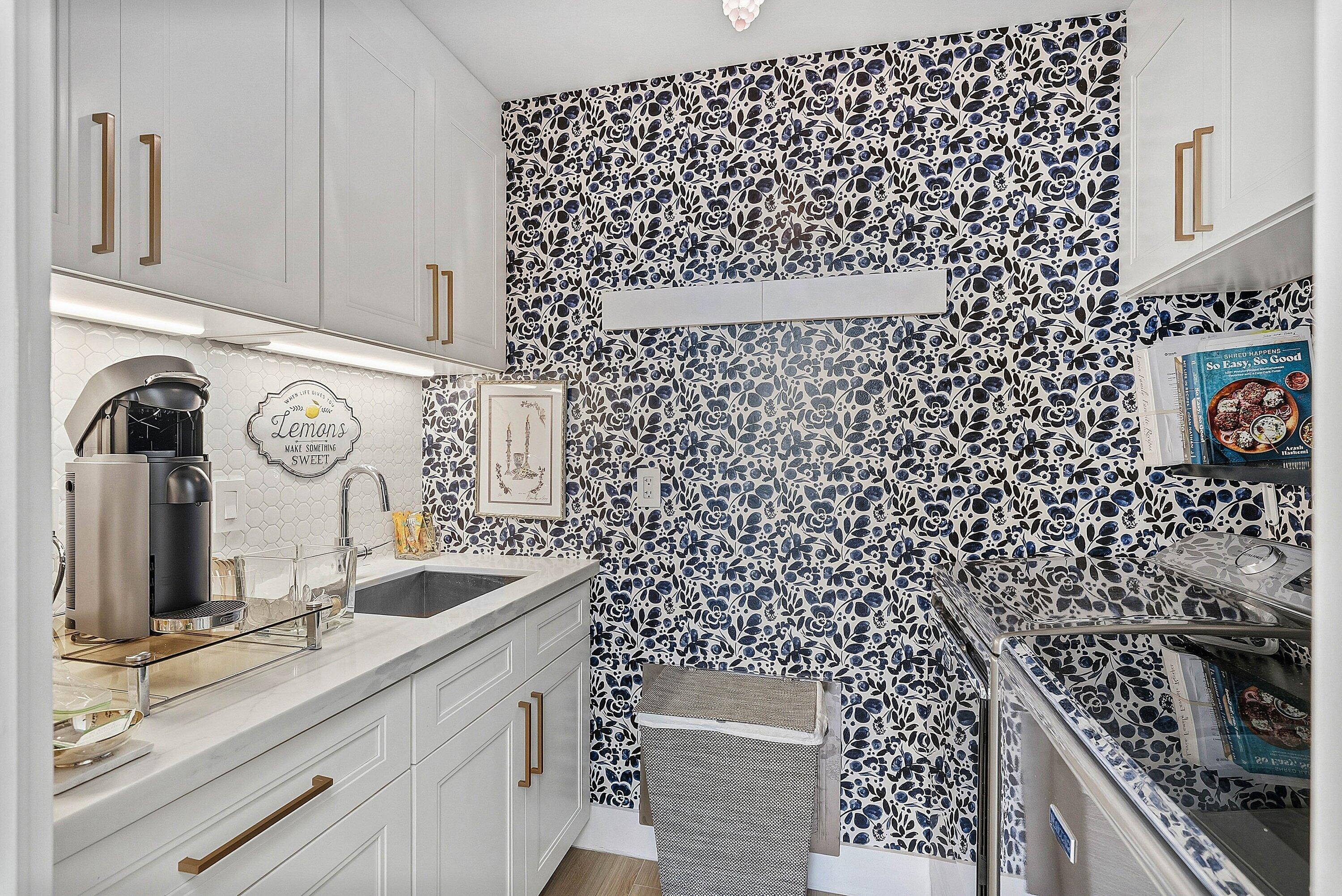 6110 North Ocean Boulevard, Unit 32 Ocean Ridge, FL 33435 - Photo 14 of 39 a kitchen with a sink and cabinets