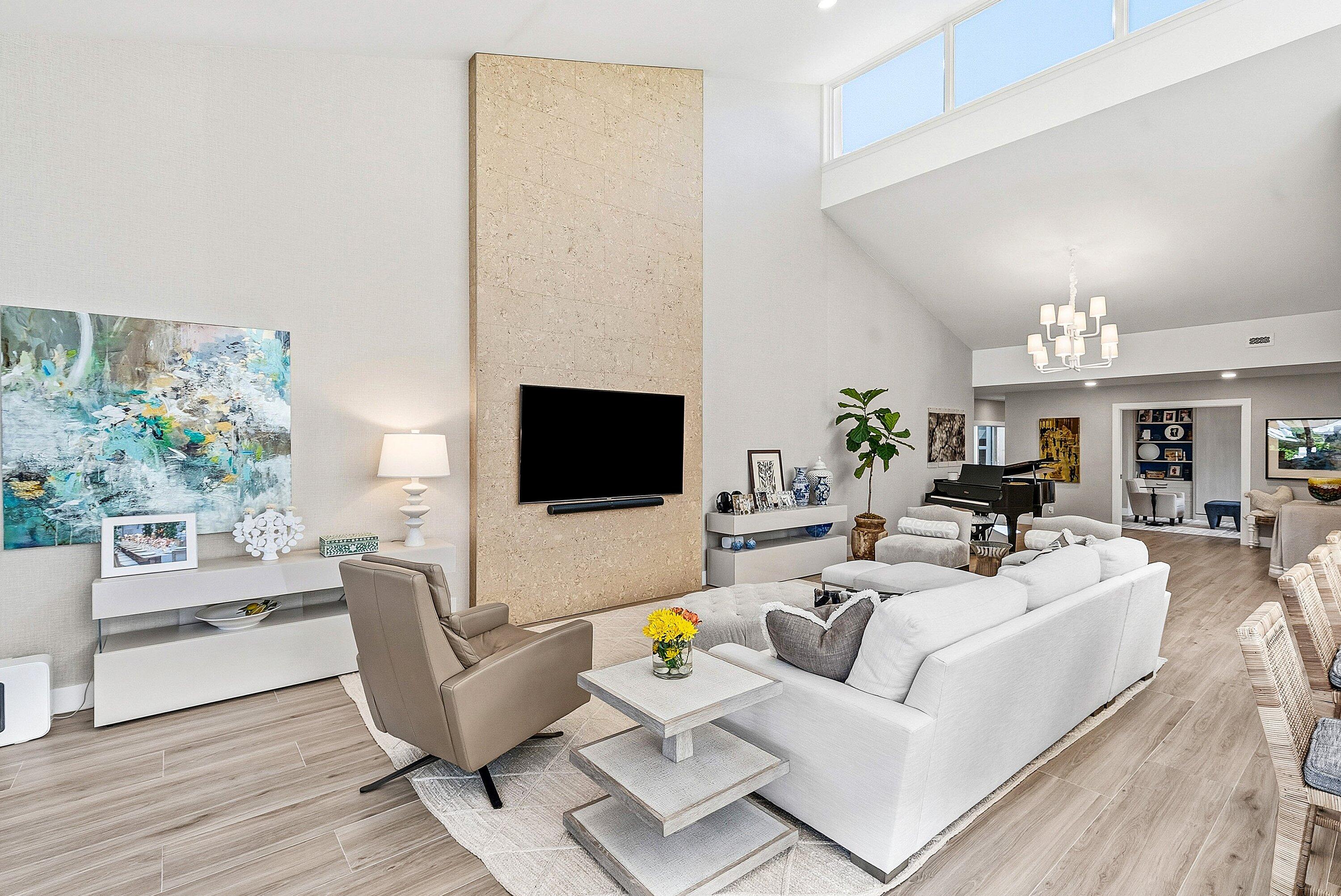 6110 North Ocean Boulevard, Unit 32 Ocean Ridge, FL 33435 - Photo 16 of 39 a living room with furniture and a flat screen tv