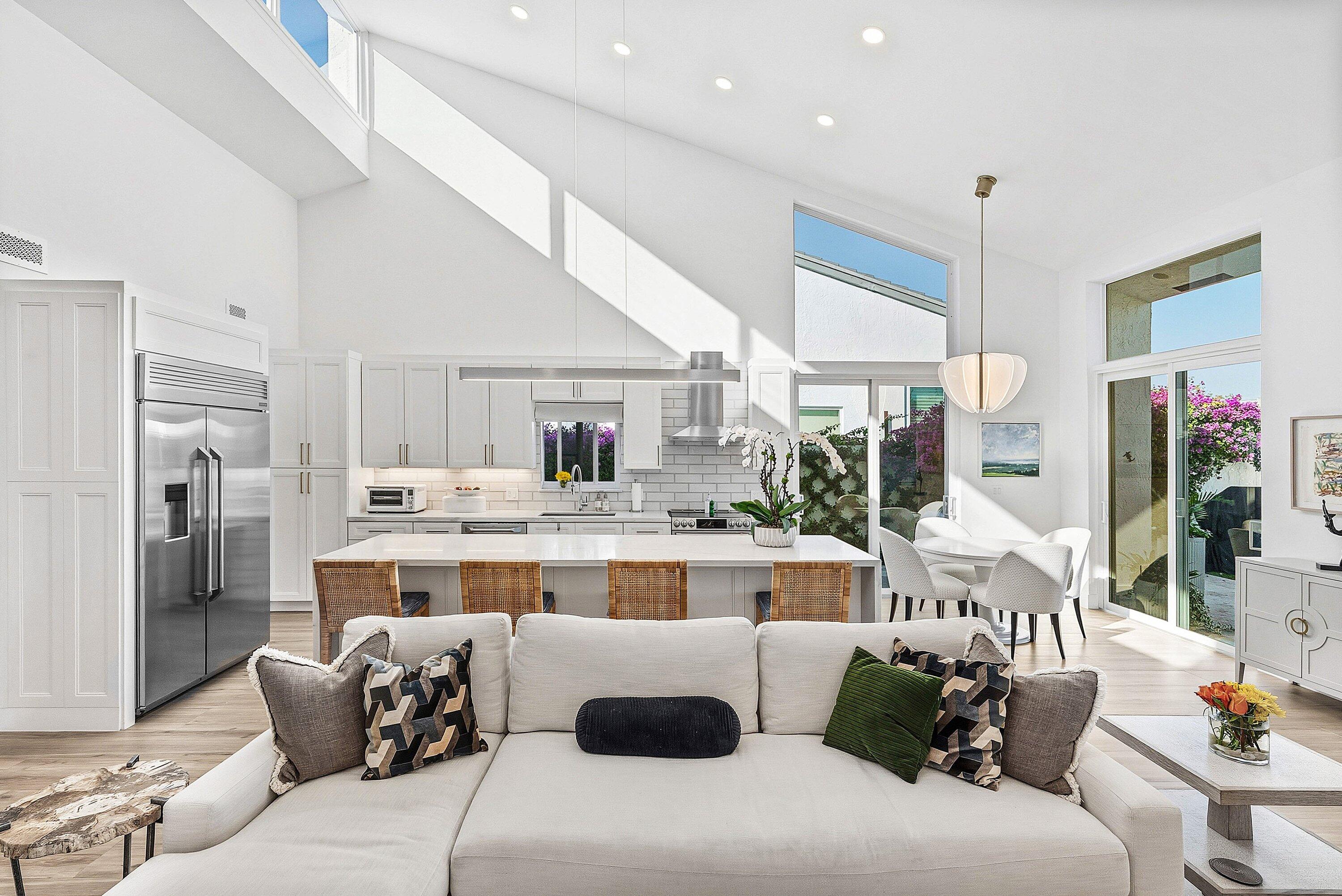 6110 North Ocean Boulevard, Unit 32 Ocean Ridge, FL 33435 - Photo 18 of 39 a large living room with stainless steel appliances kitchen island granite countertop a couch and a view of living room