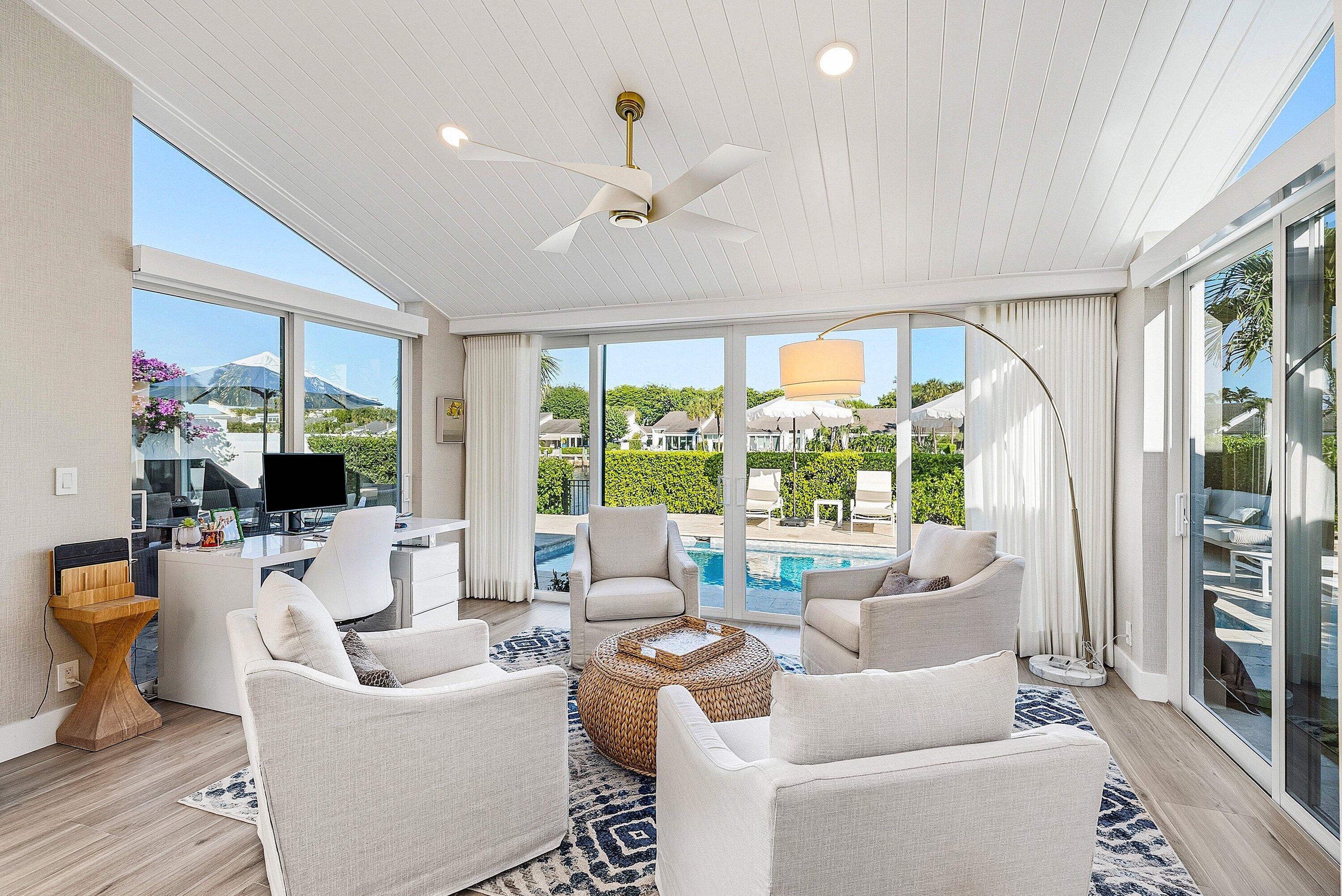 6110 North Ocean Boulevard, Unit 32 Ocean Ridge, FL 33435 - Photo 19 of 39 a living room with furniture and a large window