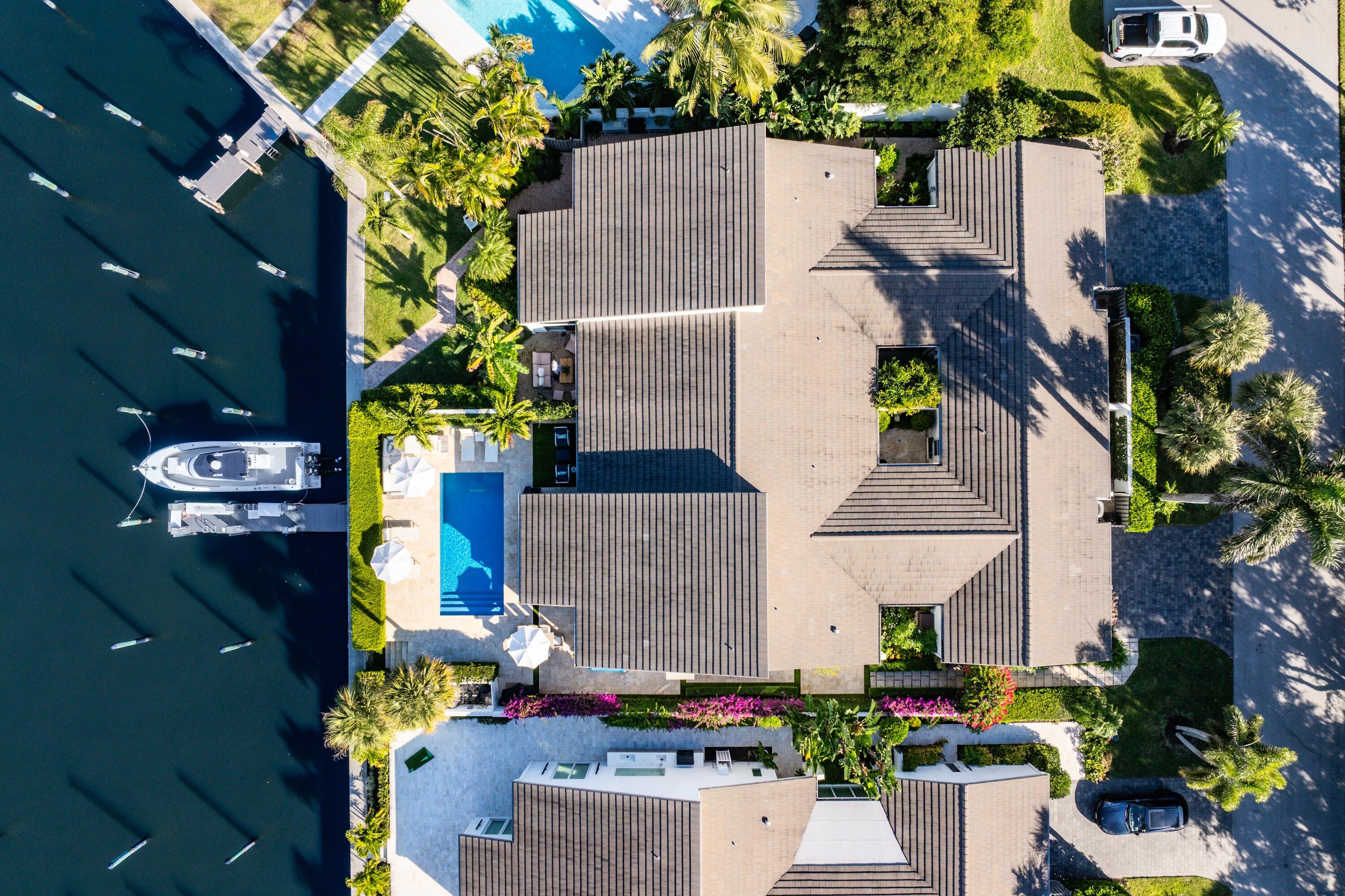 6110 North Ocean Boulevard, Unit 32 Ocean Ridge, FL 33435 - Photo 2 of 39 an aerial view of a house with a yard and garden