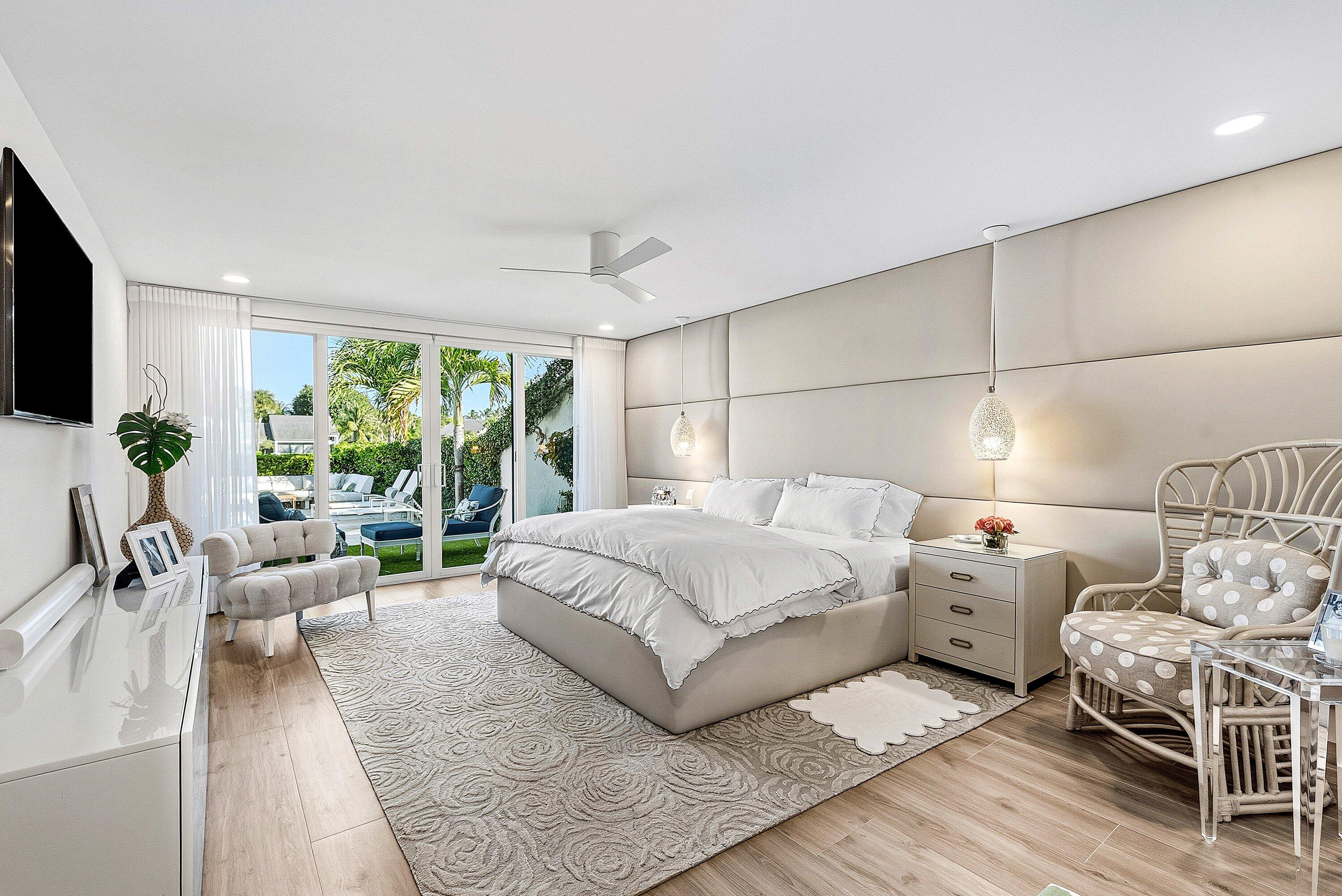 6110 North Ocean Boulevard, Unit 32 Ocean Ridge, FL 33435 - Photo 22 of 39 a bed room with a bed and a couch