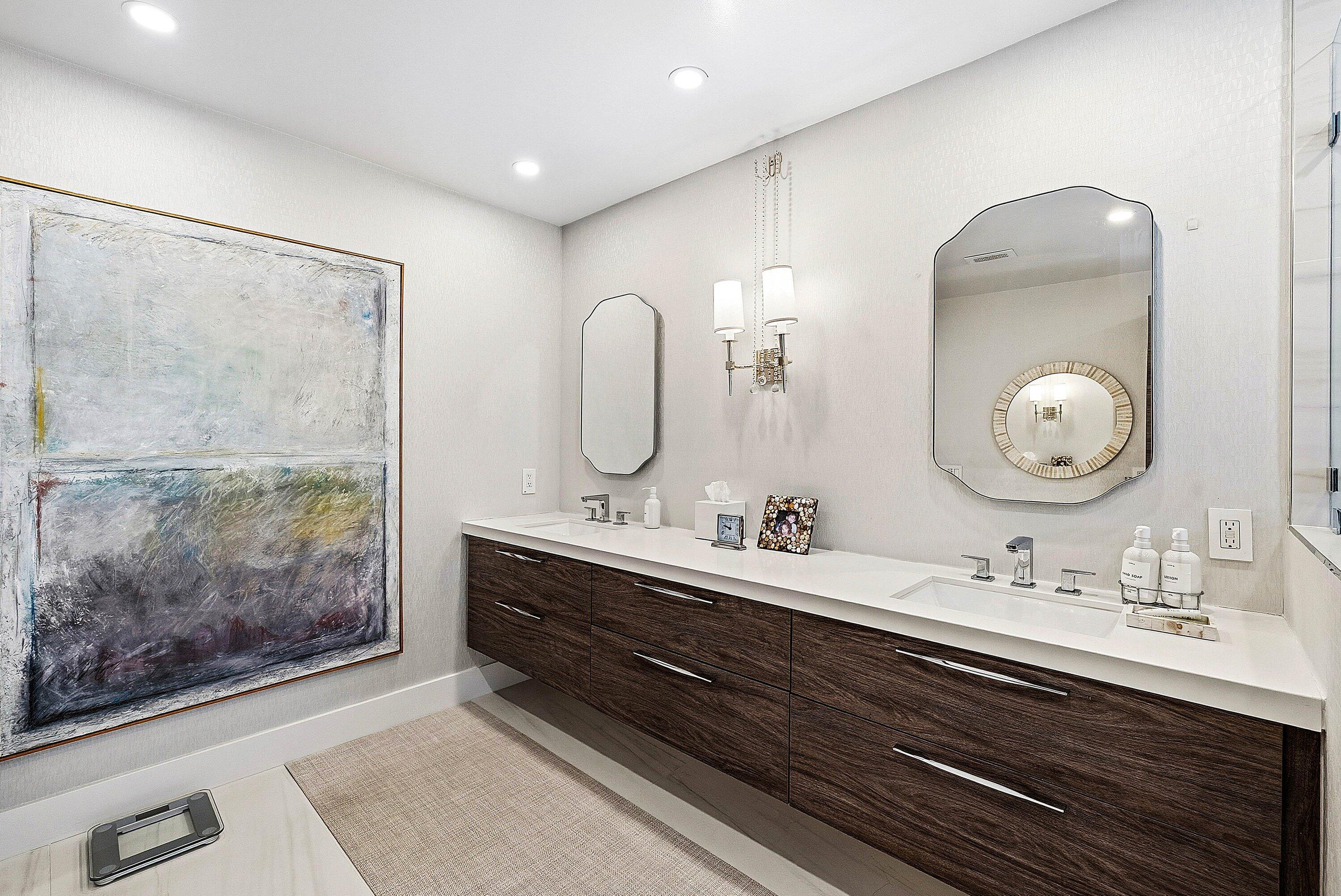 6110 North Ocean Boulevard, Unit 32 Ocean Ridge, FL 33435 - Photo 25 of 39 a bathroom with a double vanity sink mirror and shower