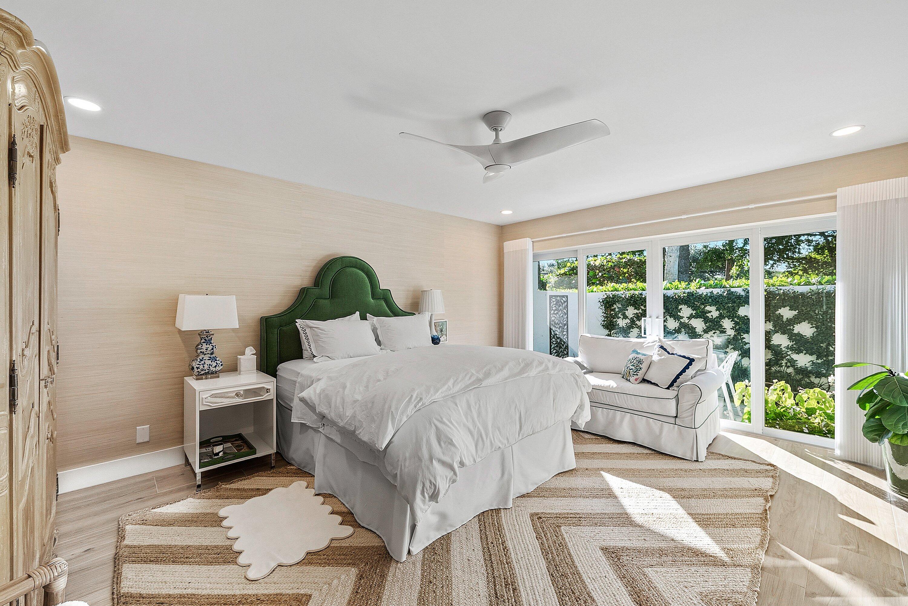 6110 North Ocean Boulevard, Unit 32 Ocean Ridge, FL 33435 - Photo 27 of 39 a bedroom with a large bed and a window