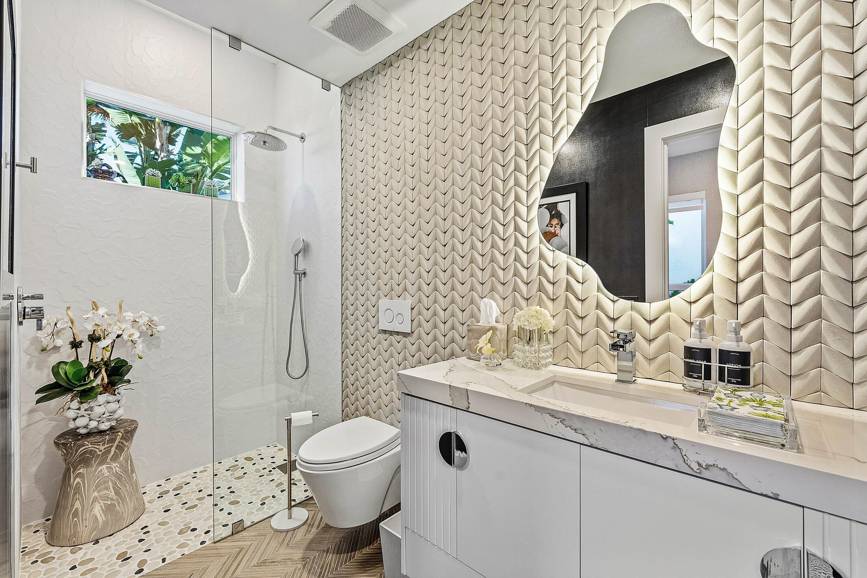 6110 North Ocean Boulevard, Unit 32 Ocean Ridge, FL 33435 - Photo 32 of 39 a bathroom with a granite countertop sink toilet and shower