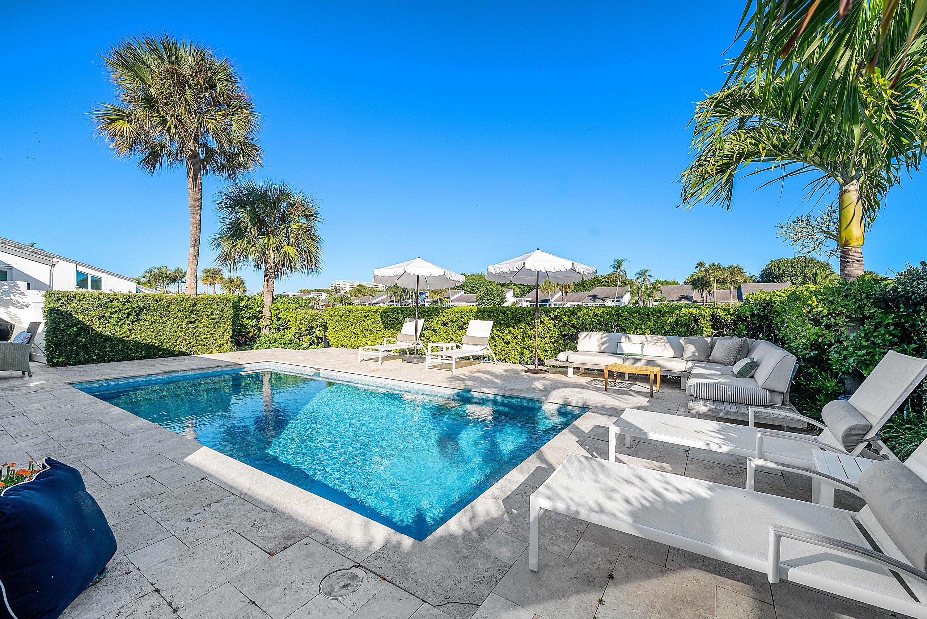 6110 North Ocean Boulevard, Unit 32 Ocean Ridge, FL 33435 - Photo 34 of 39 a view of a swimming pool and a terrace