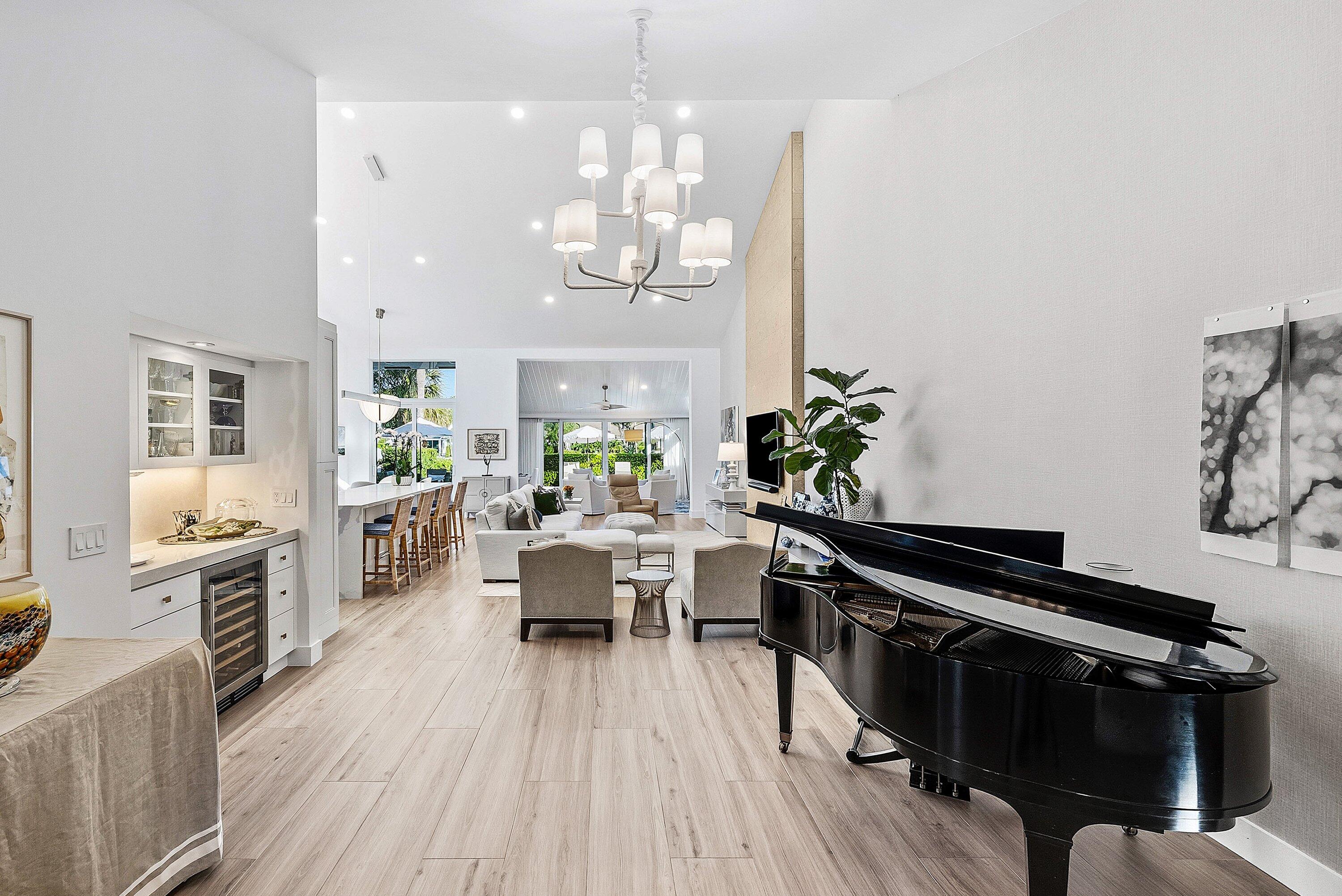 6110 North Ocean Boulevard, Unit 32 Ocean Ridge, FL 33435 - Photo 7 of 39 a living room with furniture dining table and wooden floor