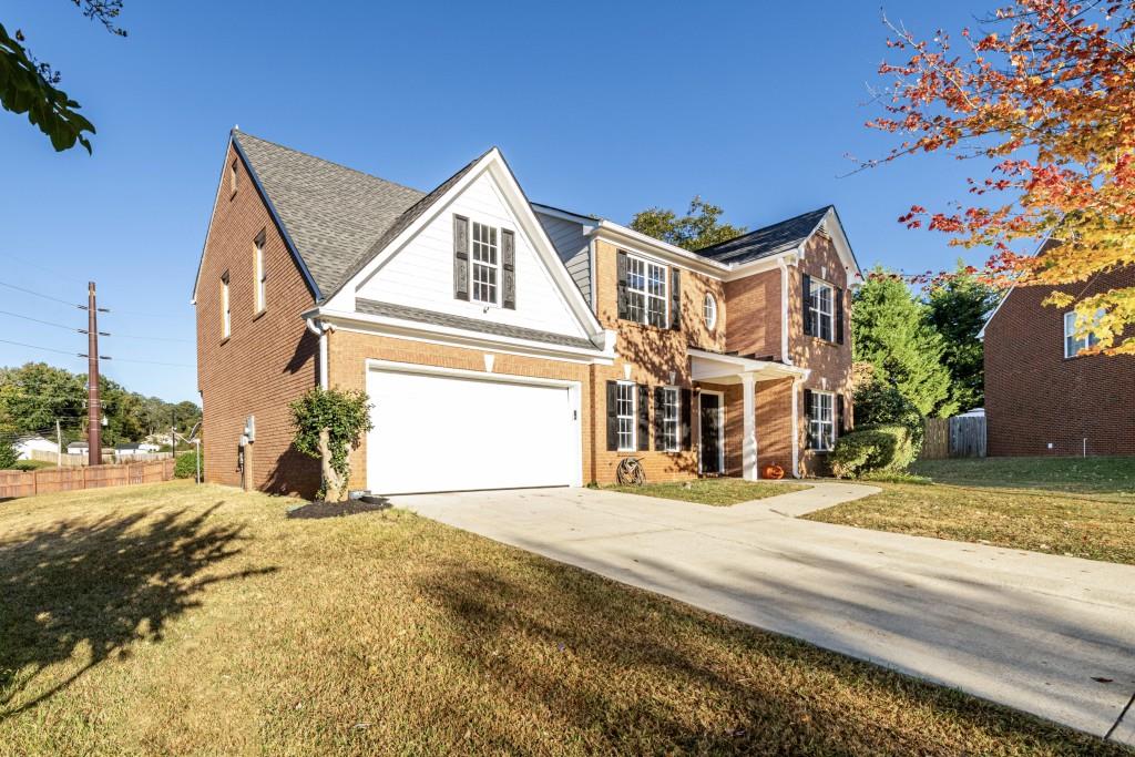 841 Chandler Road Lawrenceville, GA 30045 - Photo 1 of 1 a front view of a house with a yard