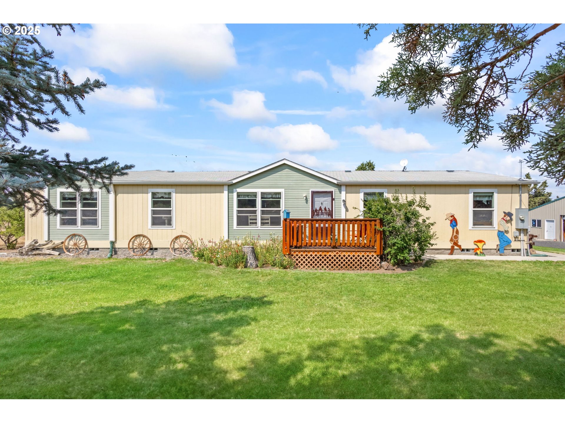 a view of a house with a yard and porch