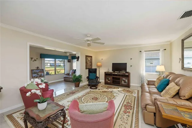 a living room with furniture fireplace and a flat screen tv