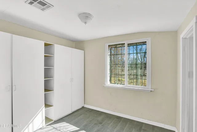 a view of walk in closet with window