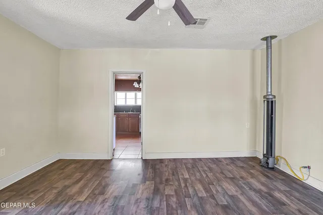 a kitchen with granite countertop cabinets and steel stainless steel appliances